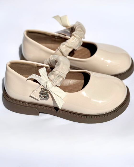 Shoes with a strap and the letter A, School