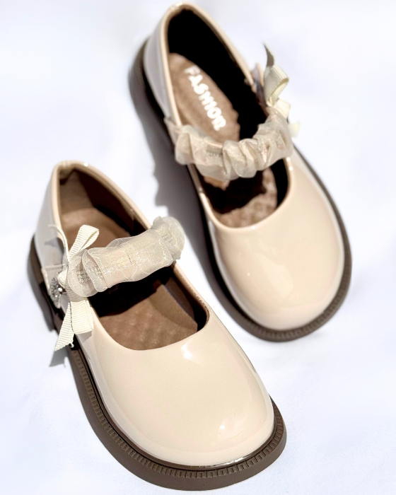 Shoes with a strap and the letter A, School