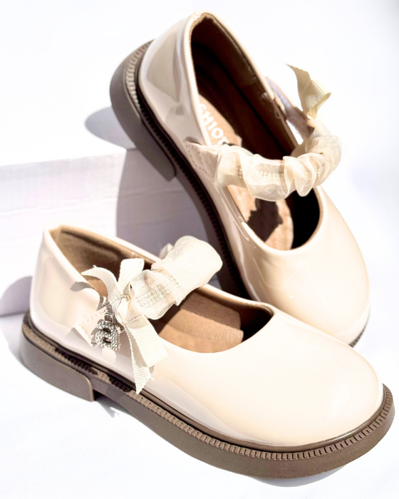 Shoes with a strap and the letter A, School